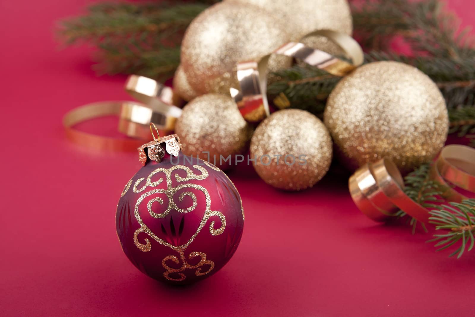 beautiful golden christmas decoration on red background sparkle