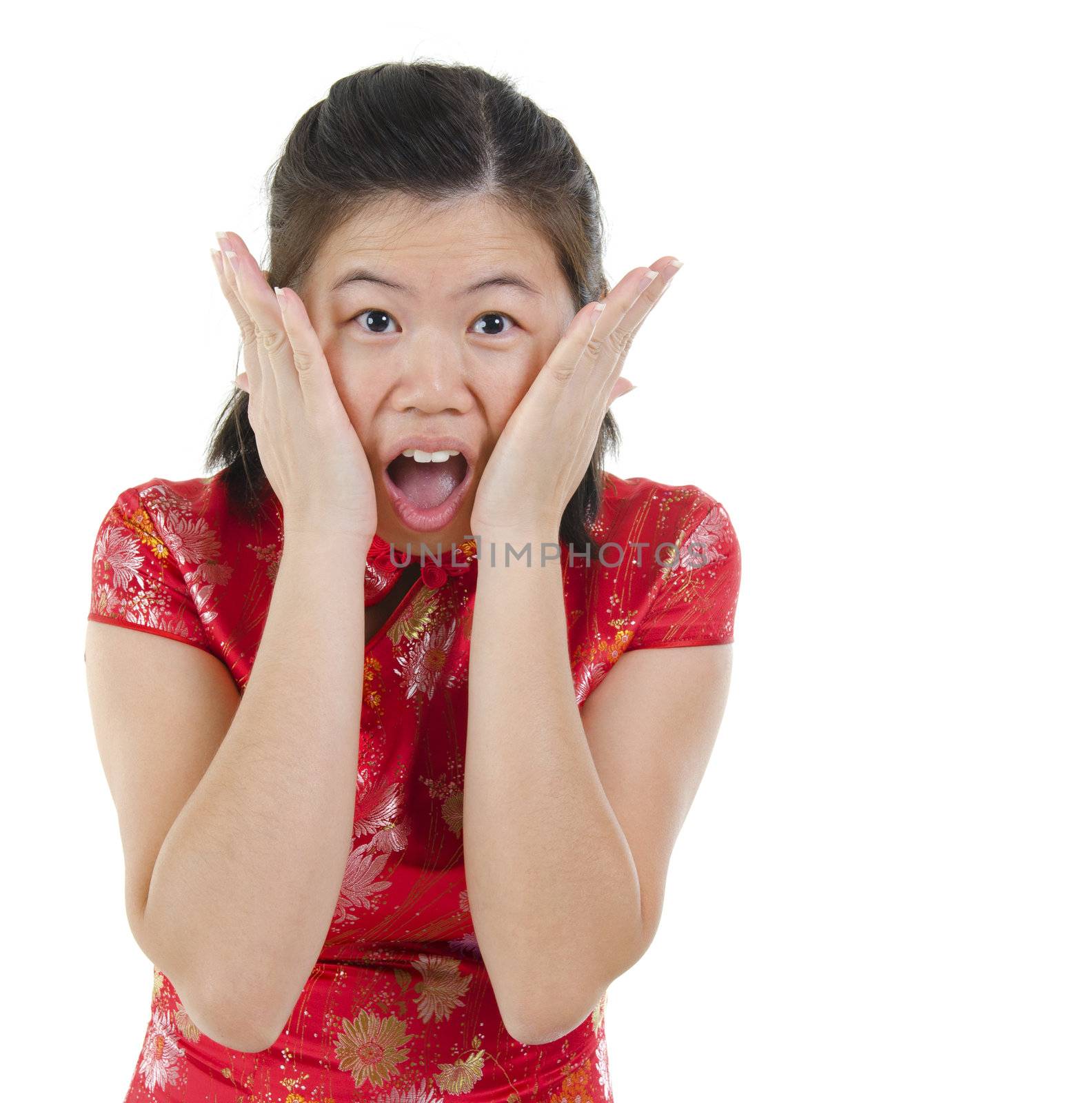 Oriental Asian female with cheongsam get shock over white background