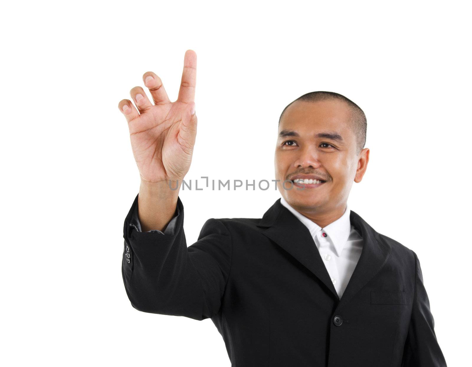 30s southeast Asian business man pointing on transparent virtual screen, space for text/button