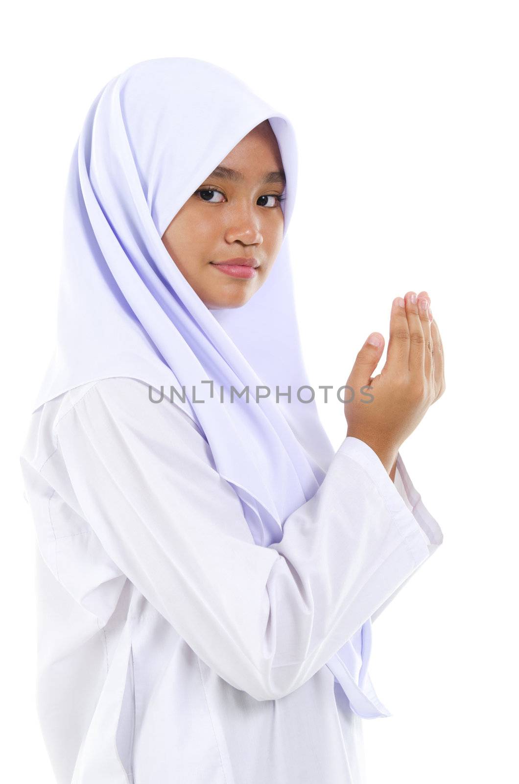 Southeast Asian youth Muslim prayer praying over white background