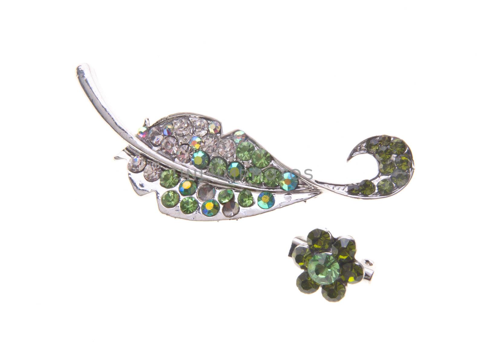 brooch with different gems on background. by heinteh