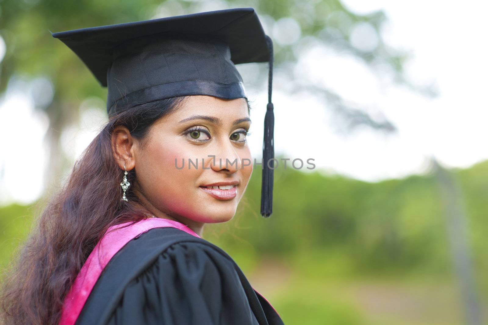 Young Asian Indian female smiling outdoor