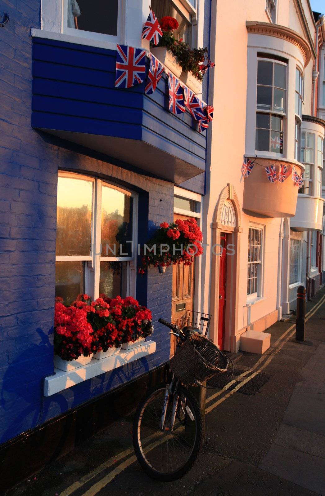 British flags hung outside traditional terraced house