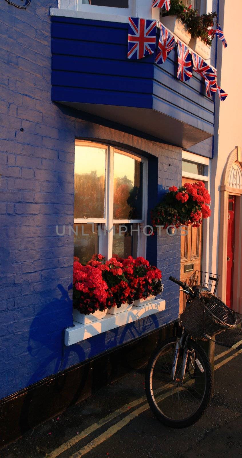 British flags hung outside traditional terraced house