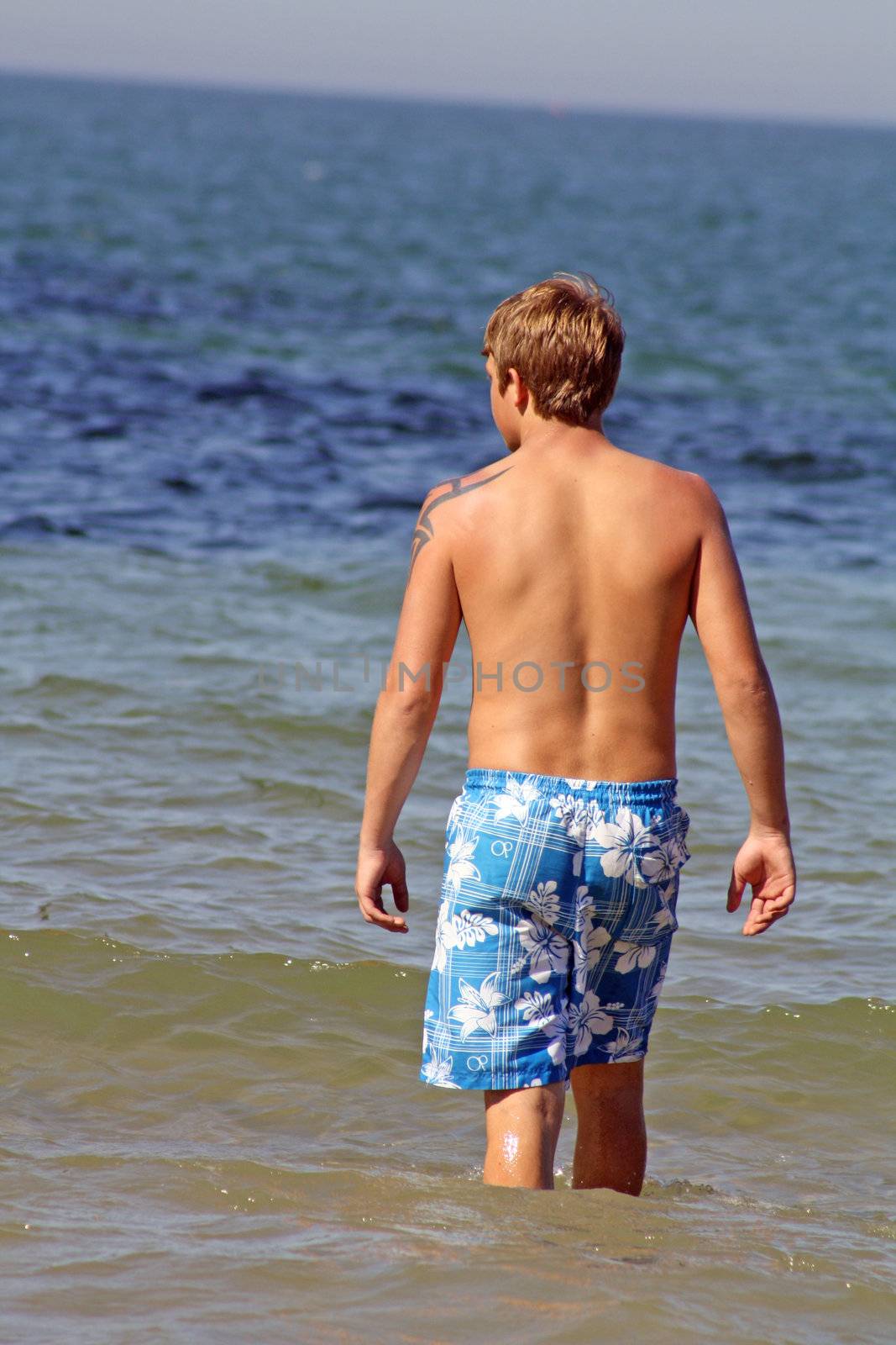 teenage boy in the sea