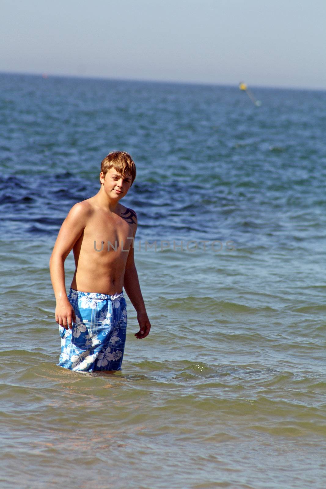 teenage boy in the sea