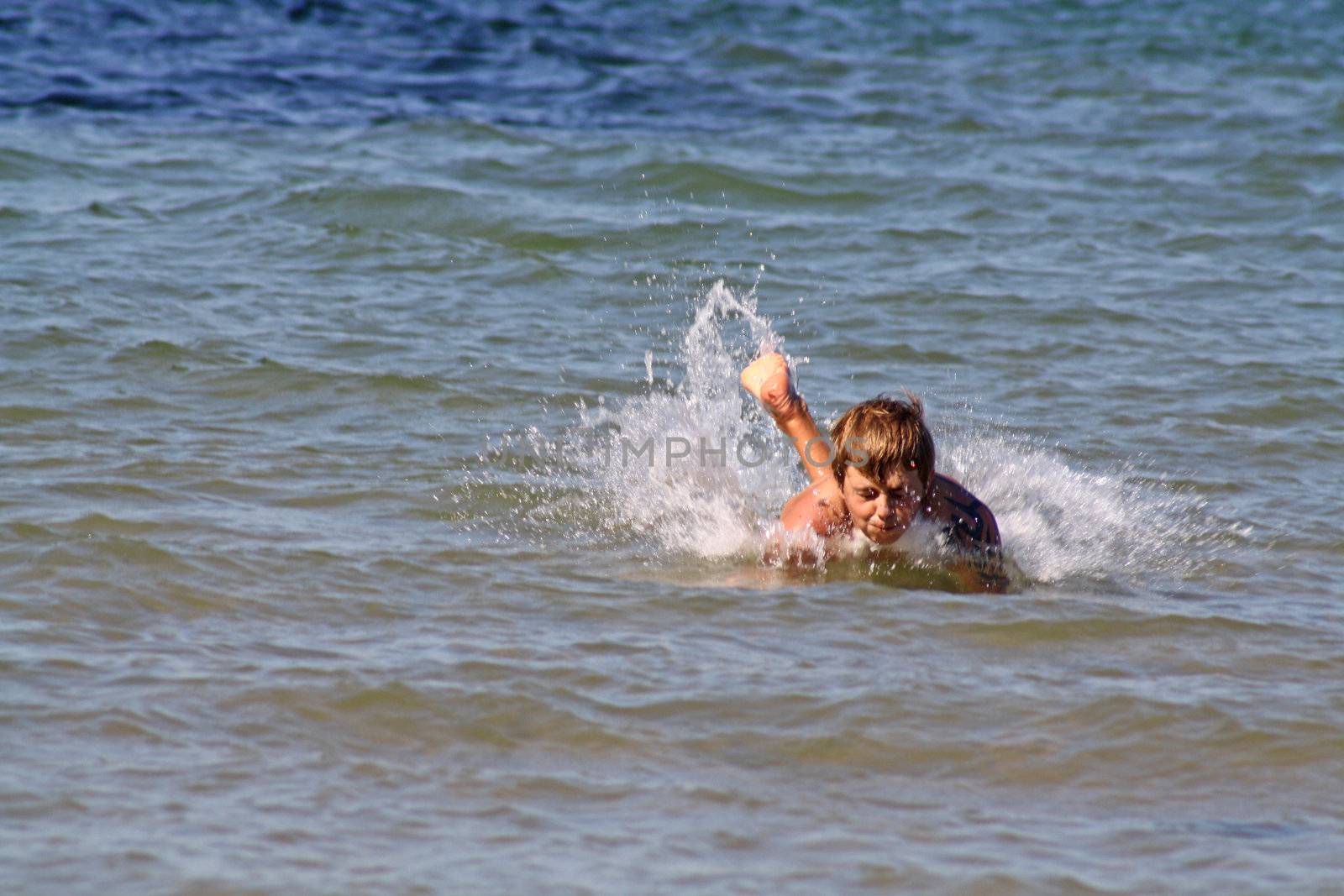 teenage boy in the sea