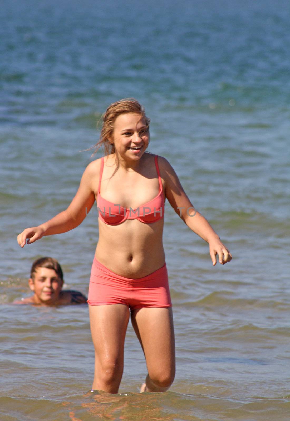 teenagers in the sea at cromer england