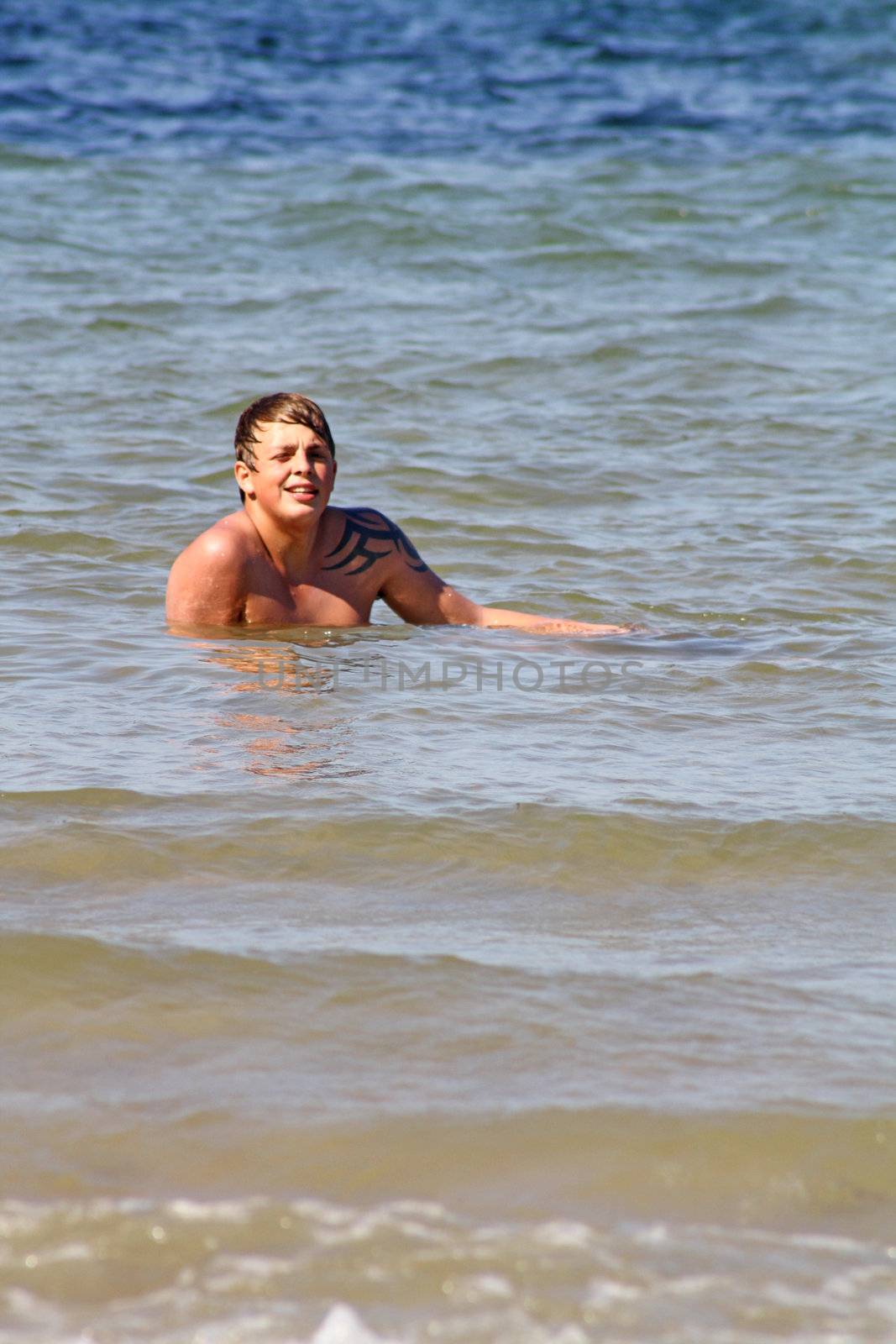 teenage boy in the sea