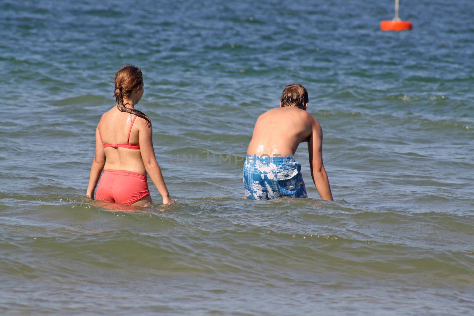 teenagers having fun in the sea
