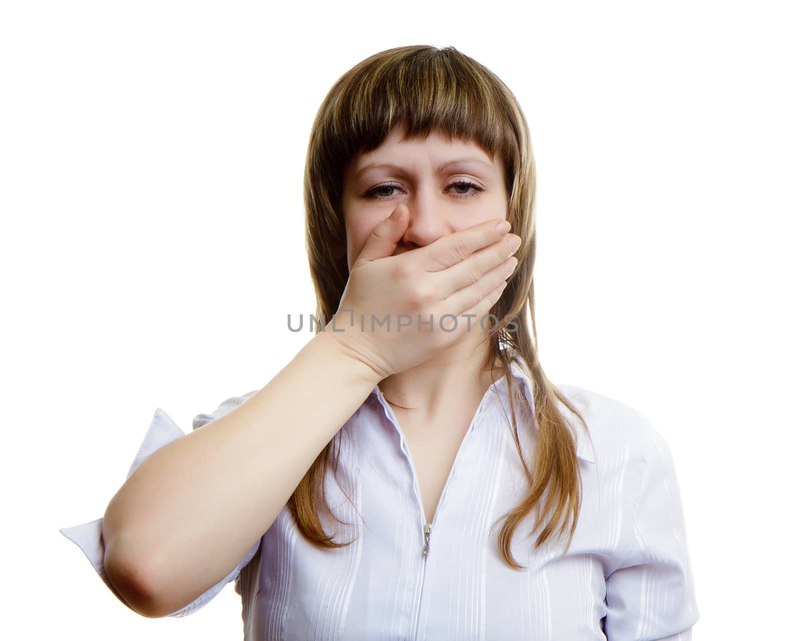 young girl covers her mouth with his hands on a white background