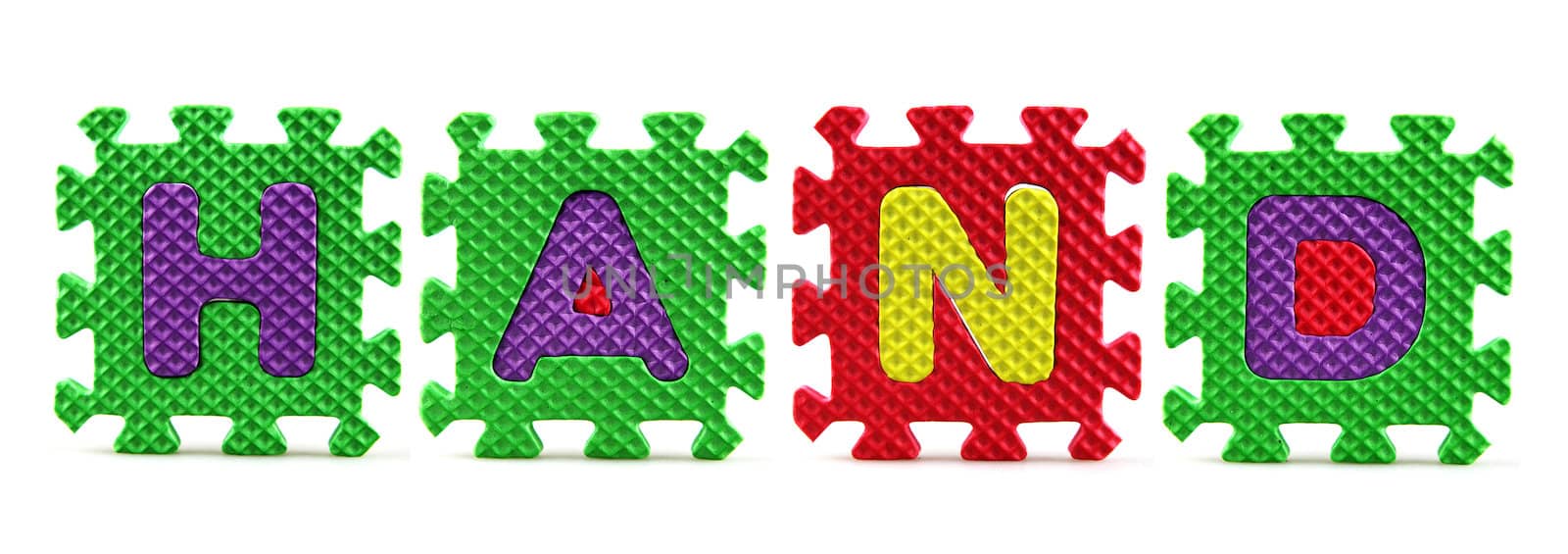 Alphabet puzzle pieces on white background