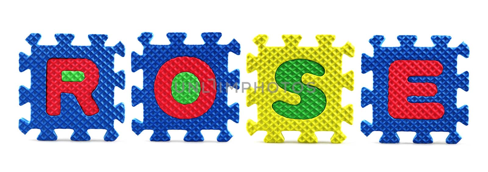 Alphabet puzzle pieces on white background