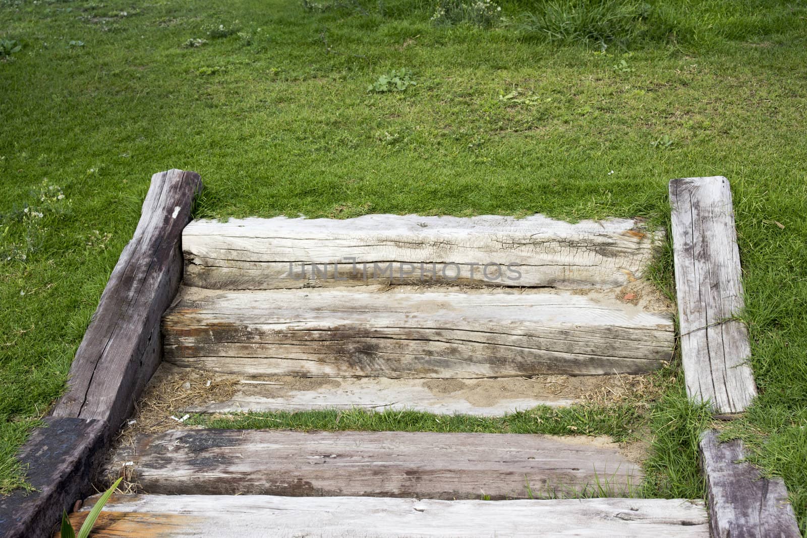 Wooden stairs are made of cracked wooden beams