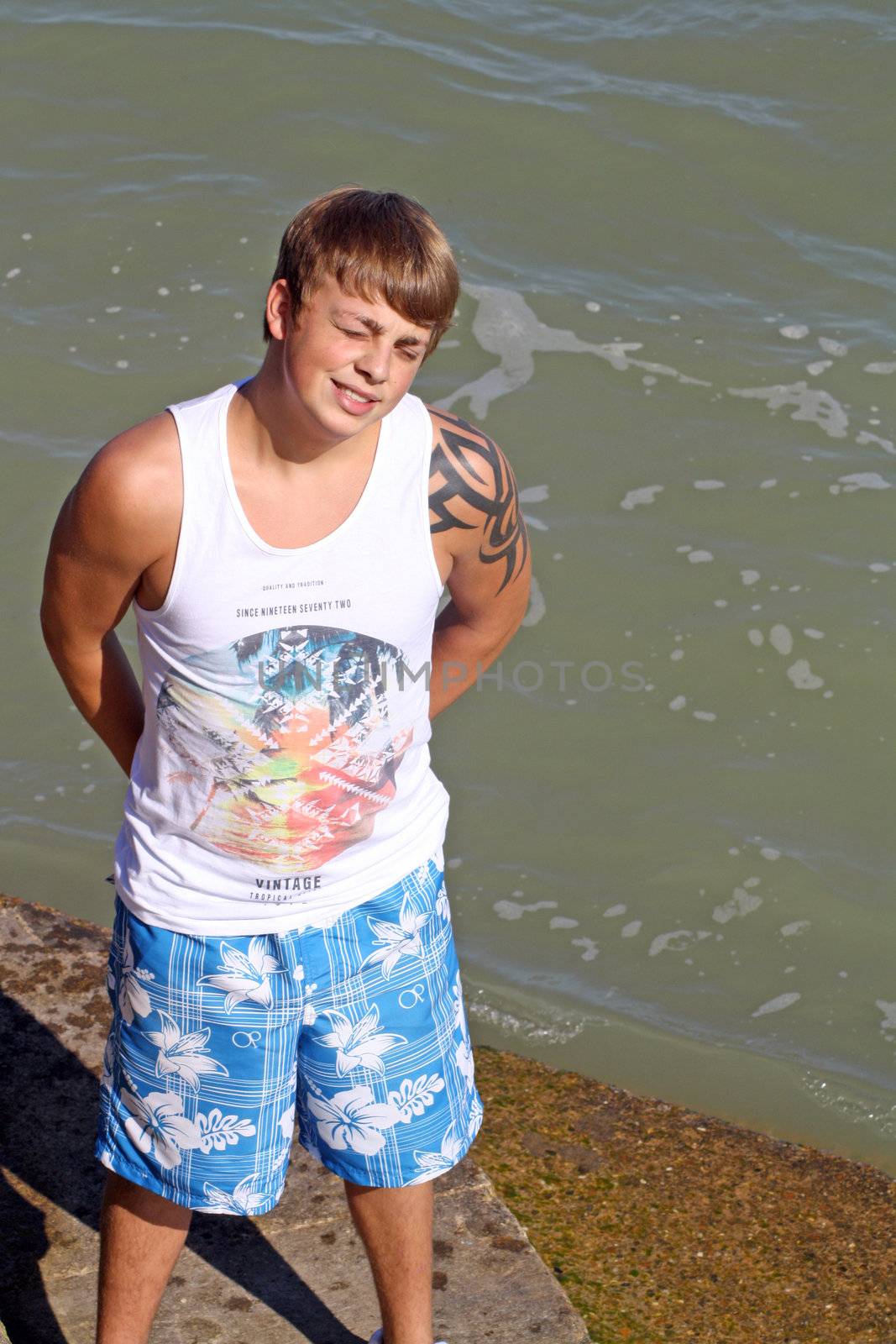 teenage boy by the sea at cromer england