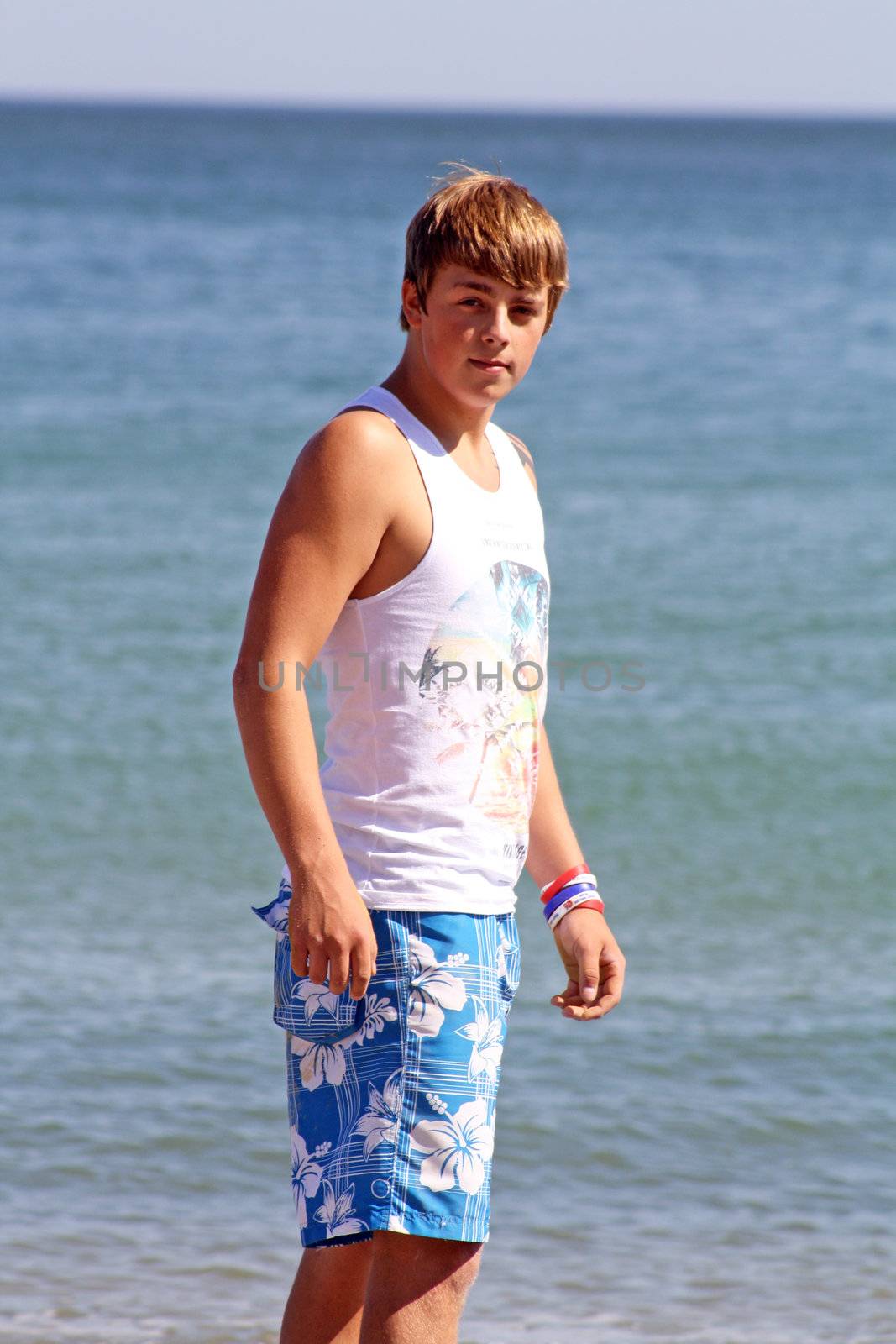 teenagers walking along the beach