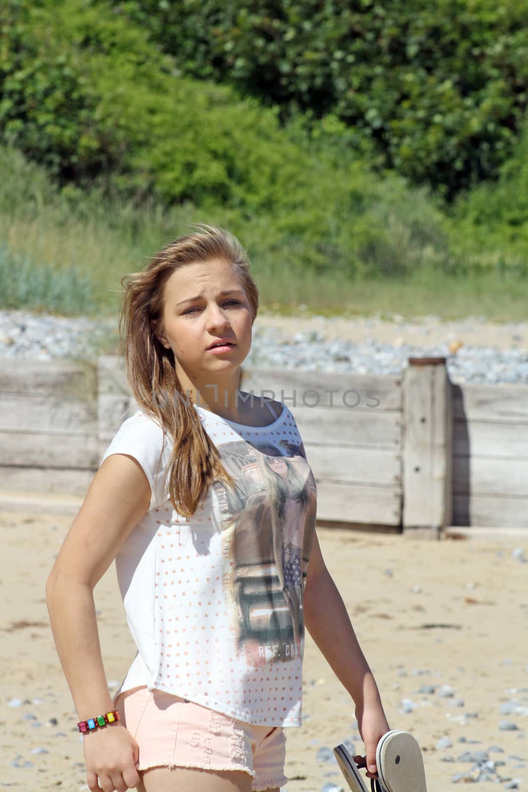 teenage girl on beach by lizapixels