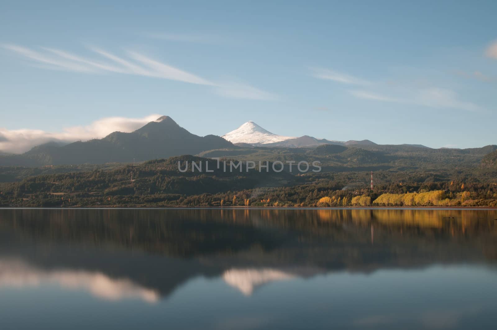 Reflection of the Volcano Villarica on the coñaripe city lake (long exposure version)