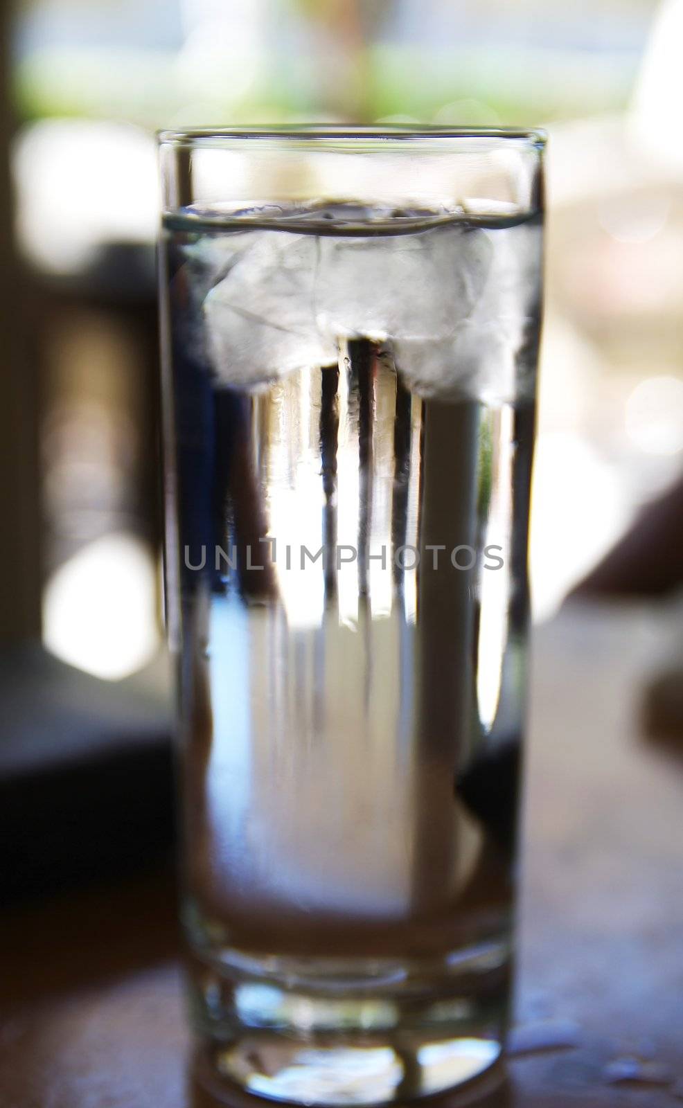 Glass of water with ice in a bar in Athens