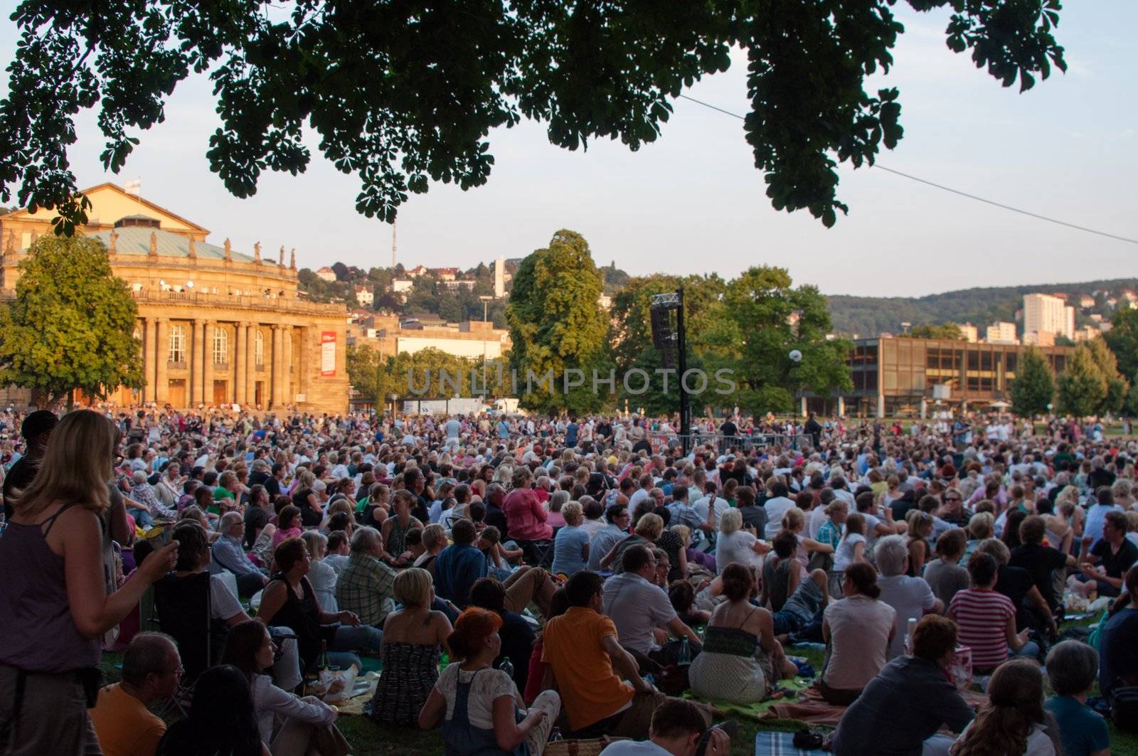 STUTTGART, GERMANY - JULY 25: More than 5.000 people are watching the public viewing of the premiere of Mozart´s opera “Don Giovanni” on a large screen in front of the Opera building in Stuttgart, Germany on July 25, 2012.