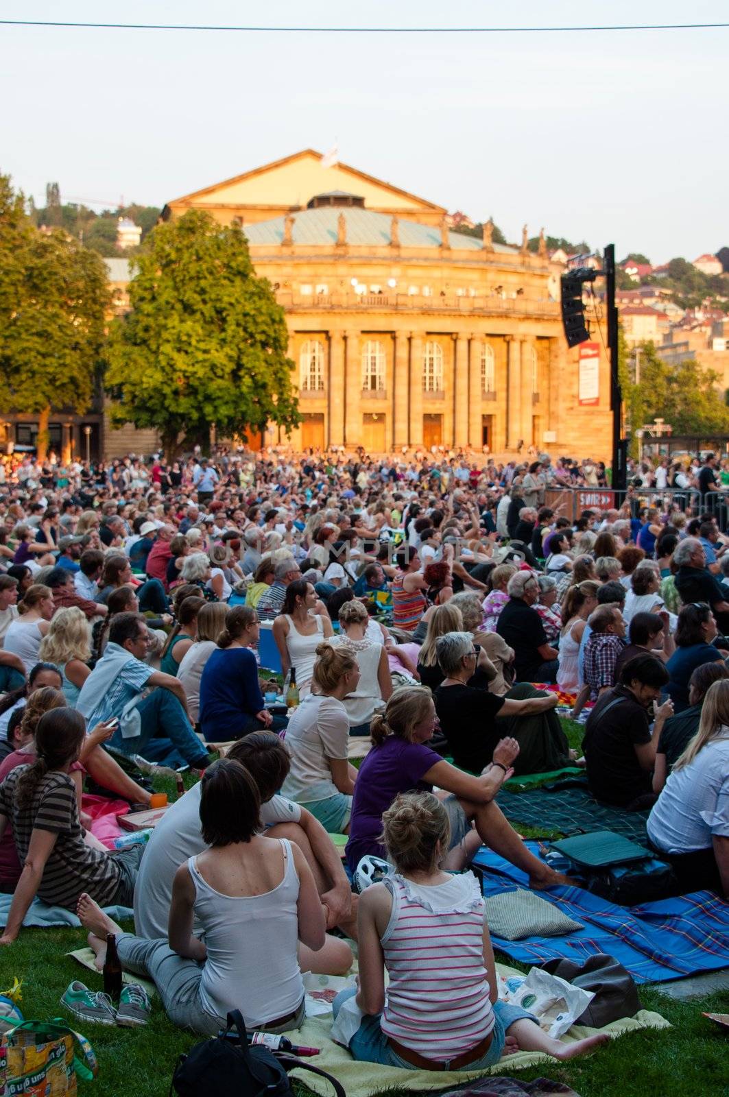 STUTTGART, GERMANY - JULY 25: More than 5.000 people are watching the public viewing of the premiere of Mozart´s opera “Don Giovanni” on a large screen in front of the Opera building in Stuttgart, Germany on July 25, 2012.