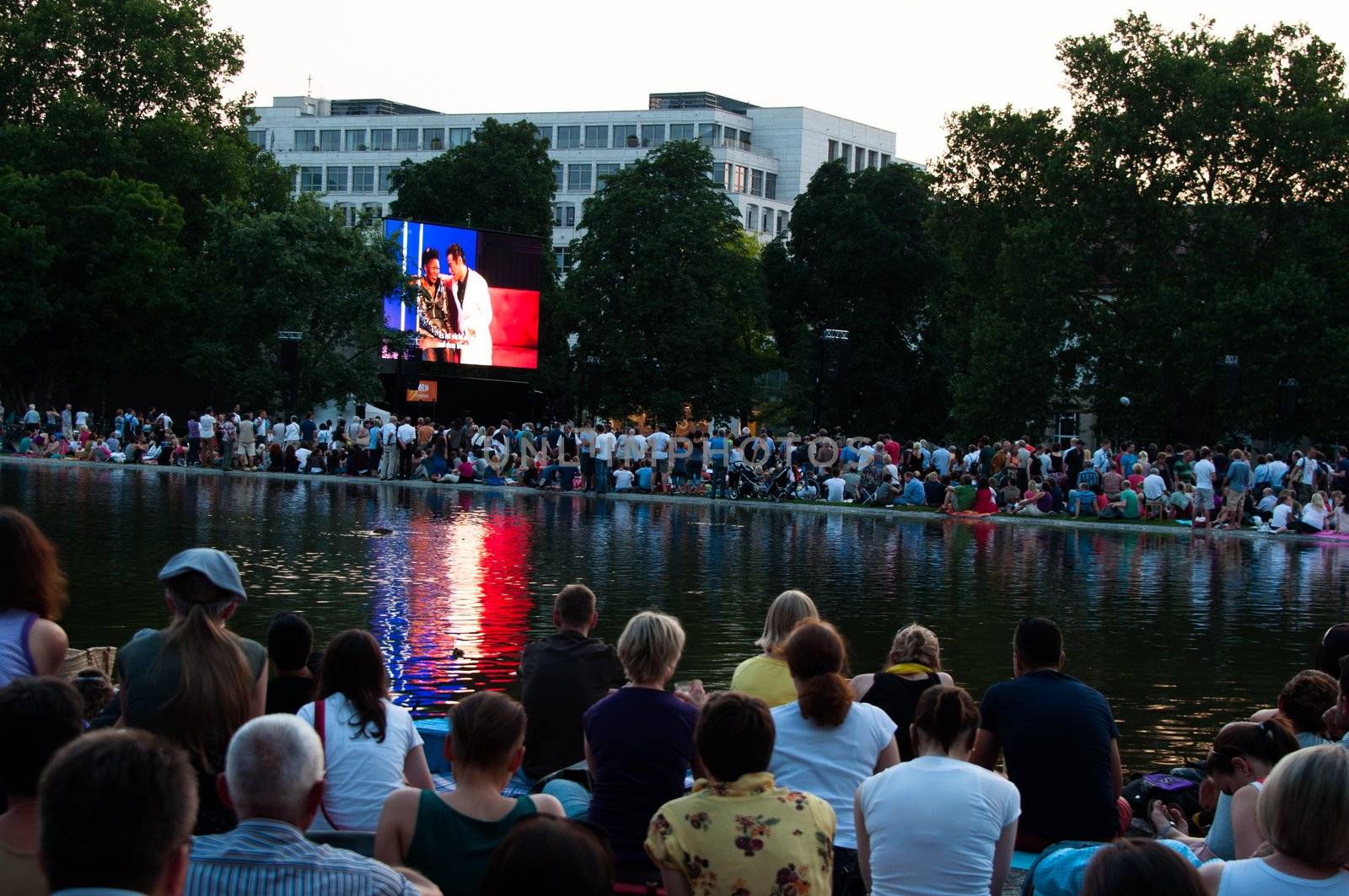 STUTTGART, GERMANY - JULY 25: More than 5.000 people are watching the public viewing of the premiere of Mozart´s opera “Don Giovanni” on a large screen in front of the Opera building in Stuttgart, Germany on July 25, 2012.