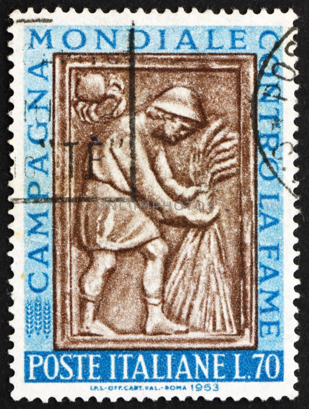 ITALY - CIRCA 1963: a stamp printed in the Italy shows Harvester Tying Sheaf, Sculpture from Maggiore Fountain, Perugia, Freedom for Hunger, circa 1963