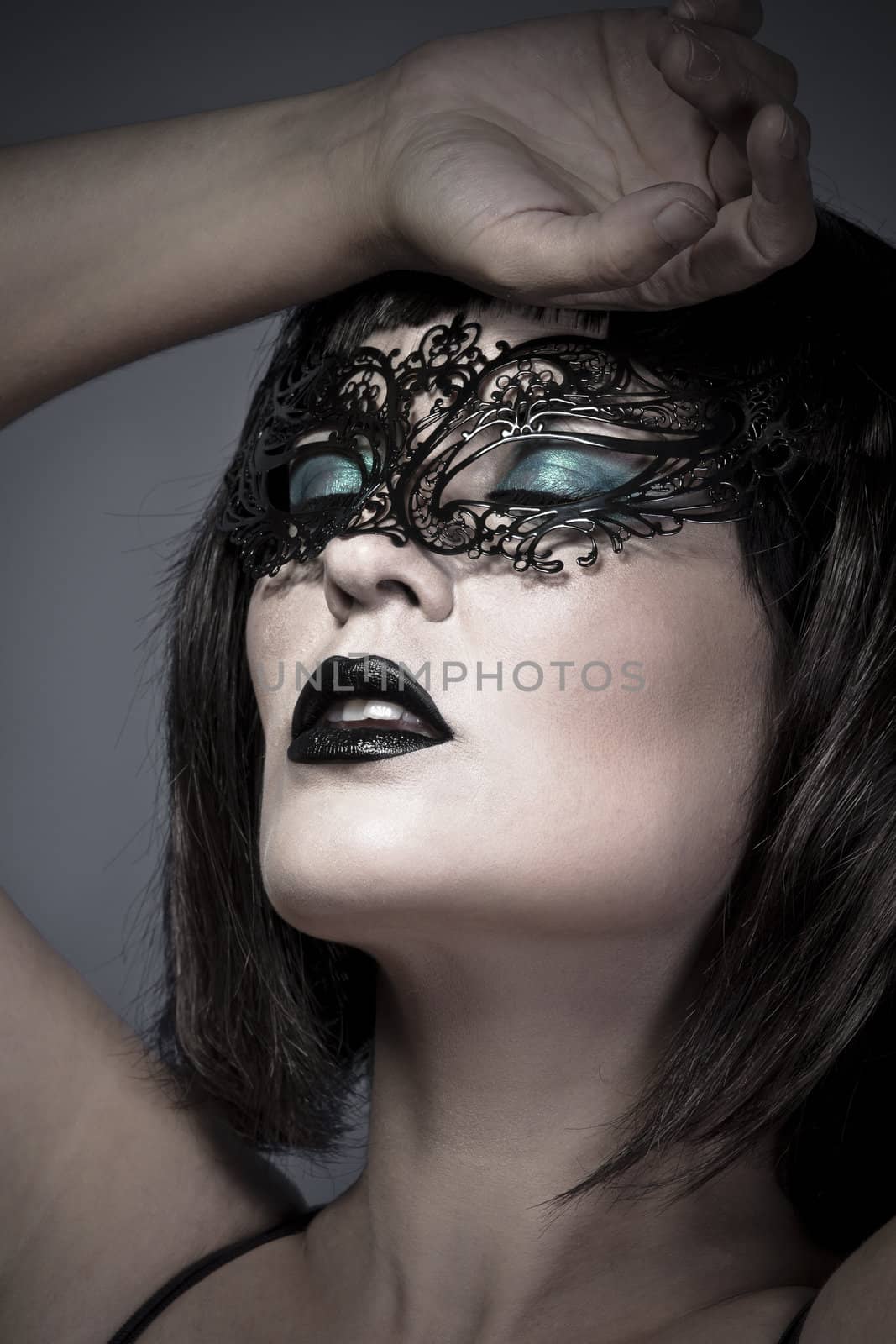 Sensual woman with delicate Venetian mask