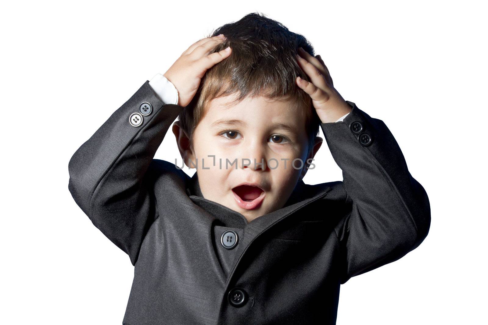 Funny child, baby dressed in suit and tie with fun face