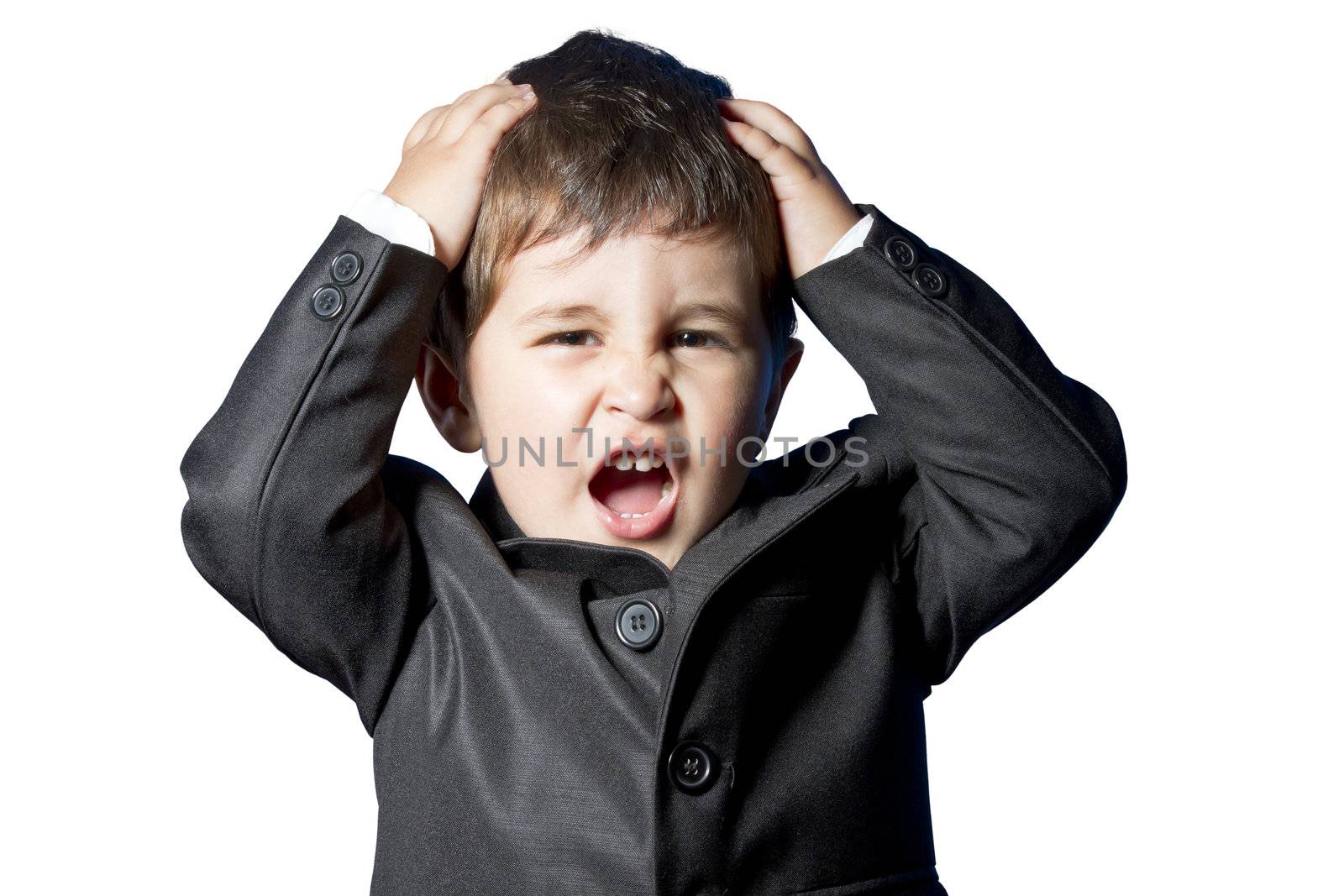 Child dressed in suit and tie with funny face