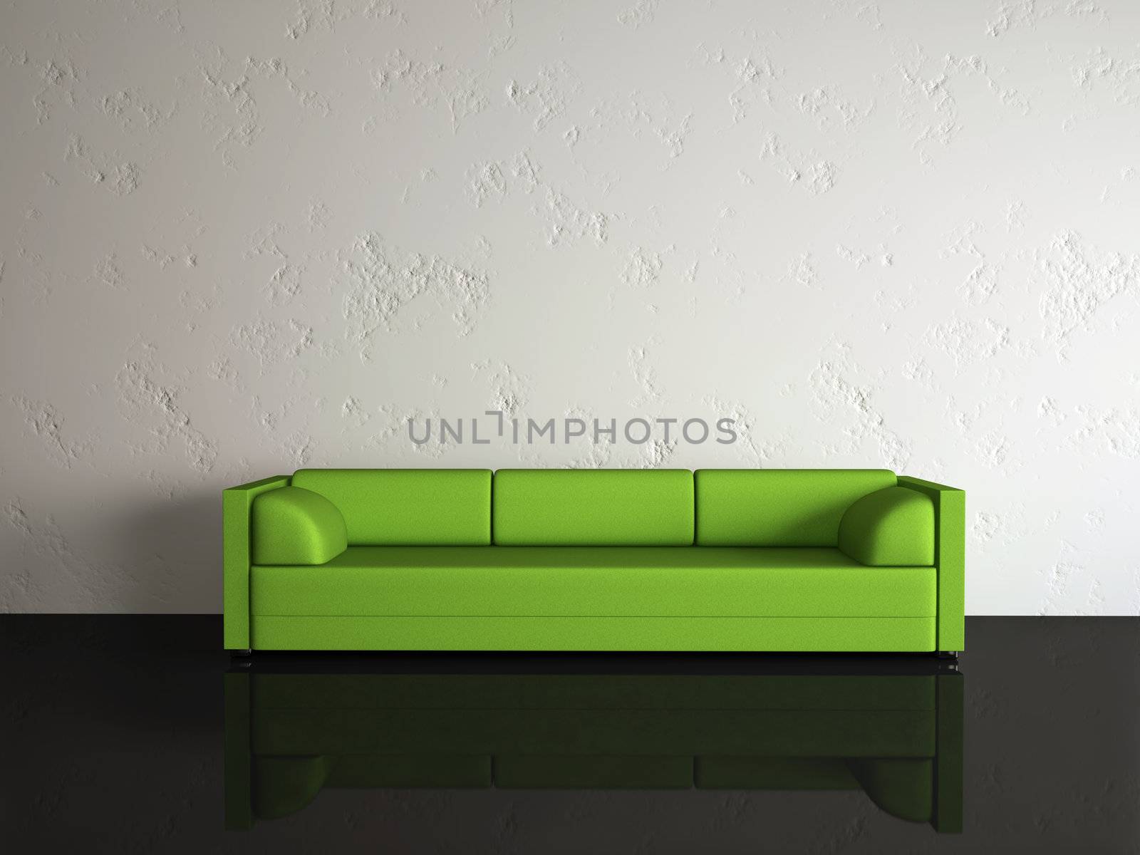 The green sofa near a white wall