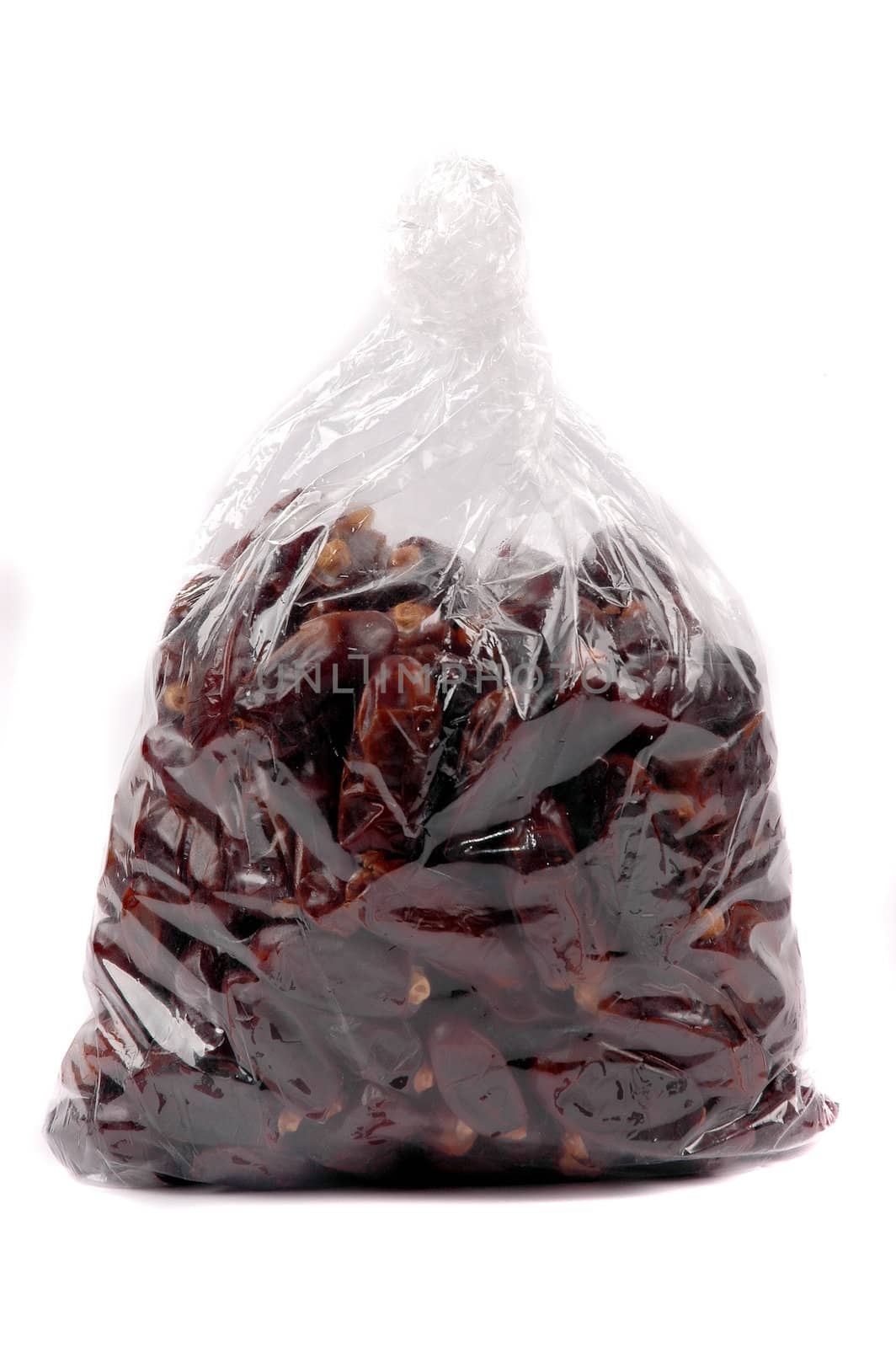 date palm fruit in a plastic bag packaging isolated on white background