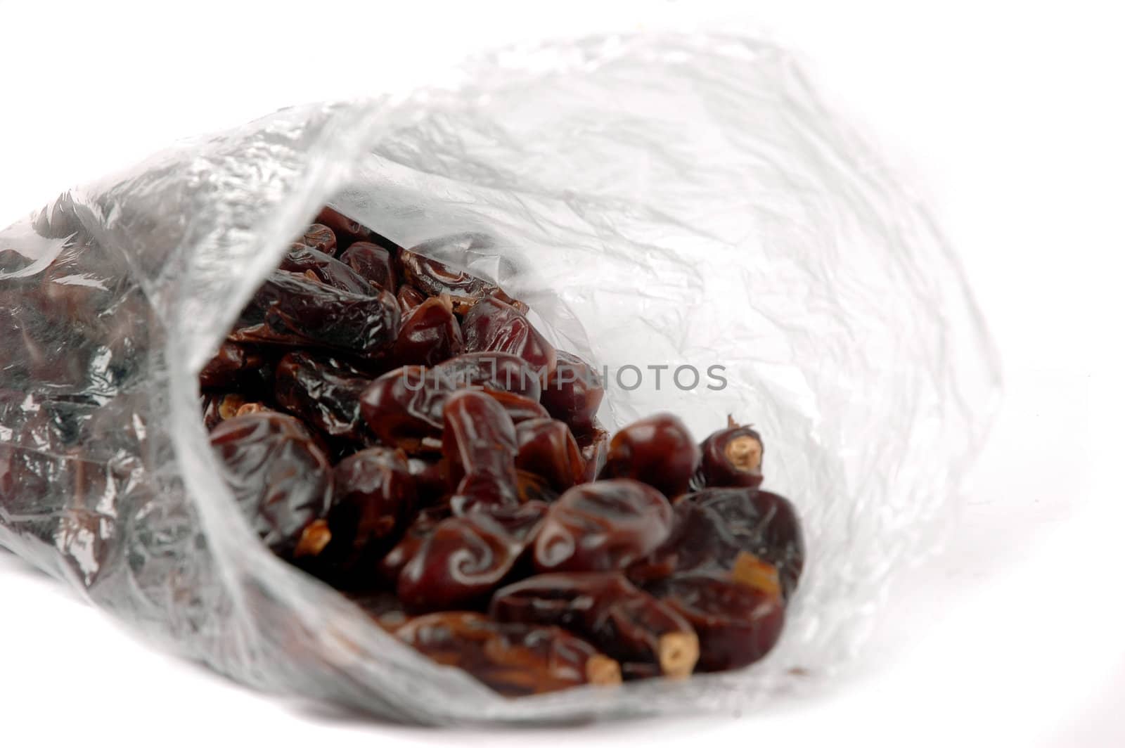 date palm fruit in a plastic bag packaging isolated on white background