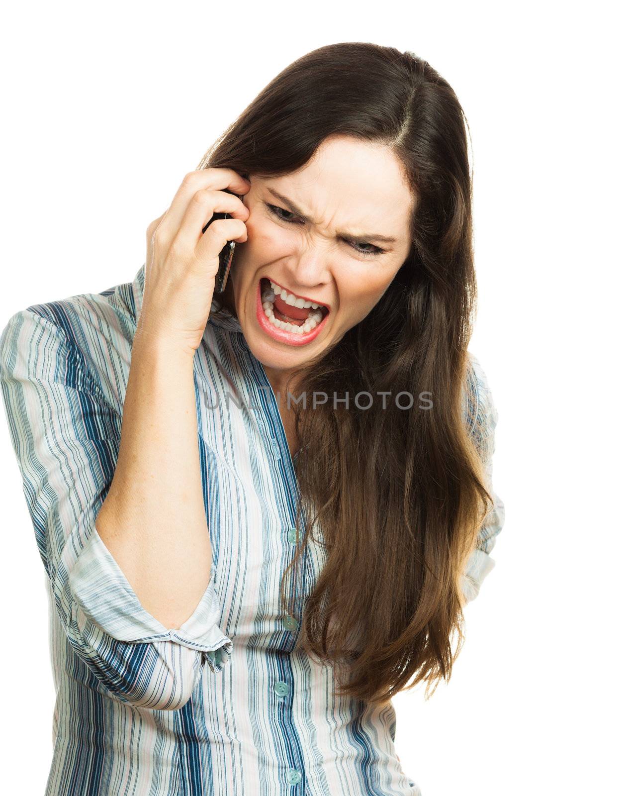 An angry and very frustrated business woman yelling on the phone. Isolated over white.
