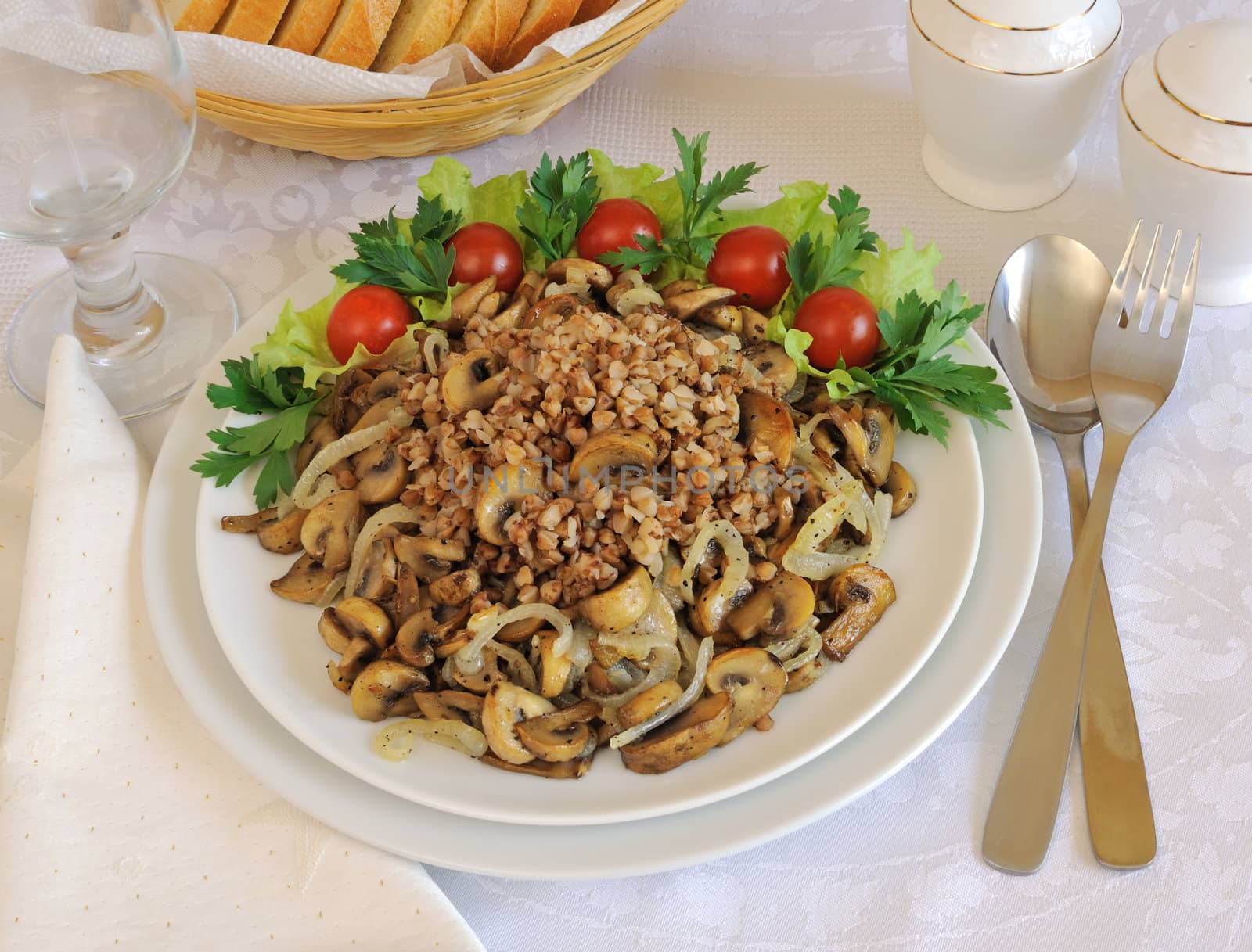 Buckwheat porridge with mushrooms and onions on the dining table