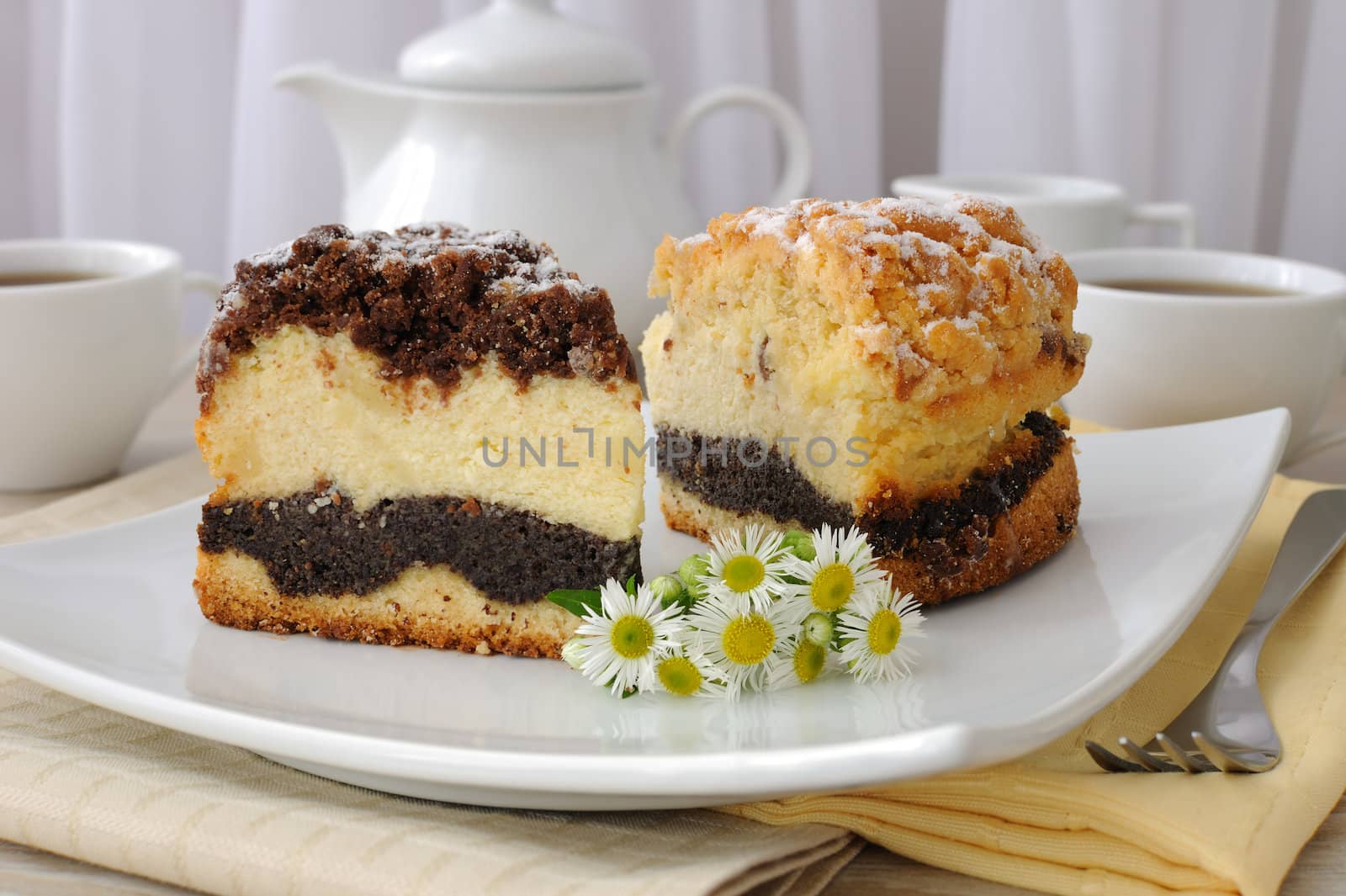 Two piece of cake with cheesecake filling poppy