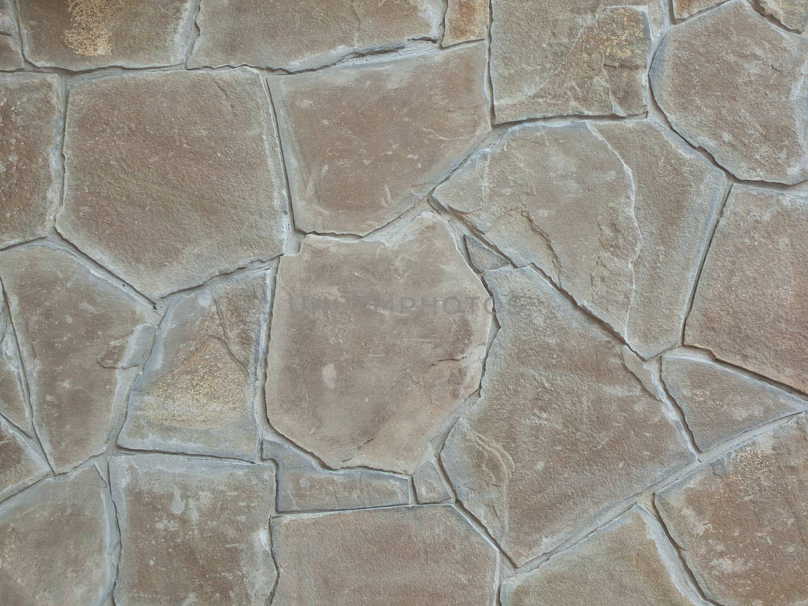 Background and texture from a wall trimmed with a stone