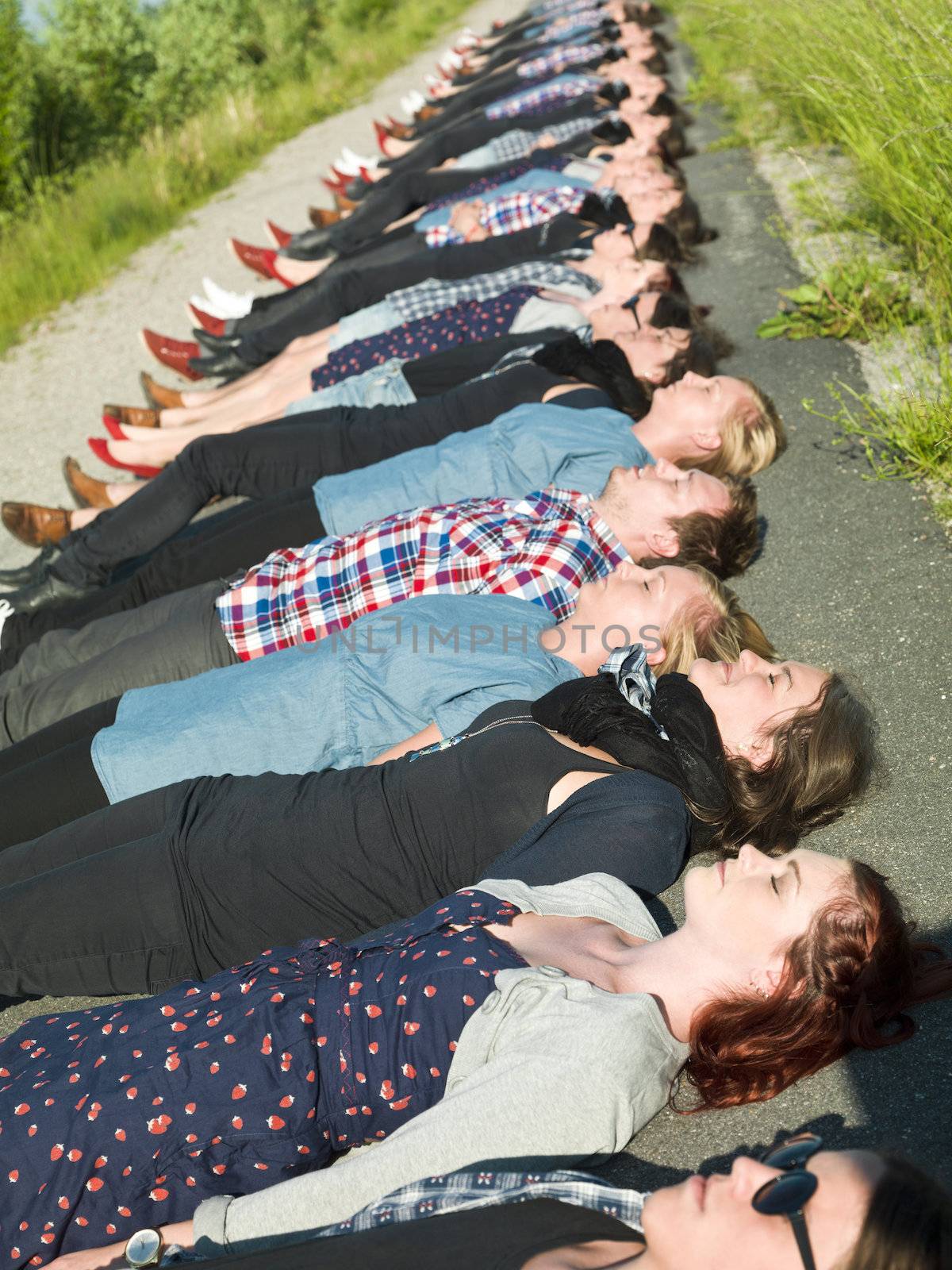 Large group of people lieing on the ground