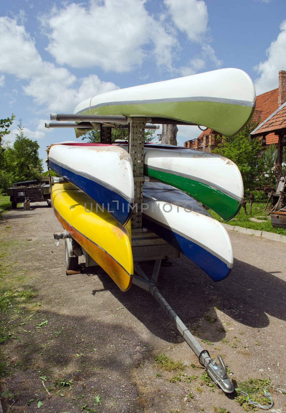 Kayaks canoes loaded on special transport trailer