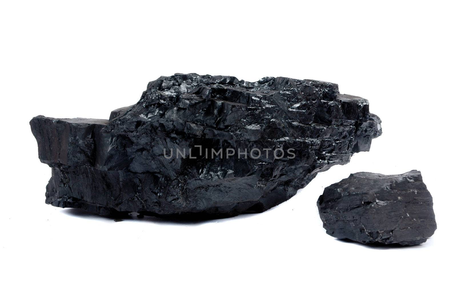 a big and small lump of coal isolated on white background