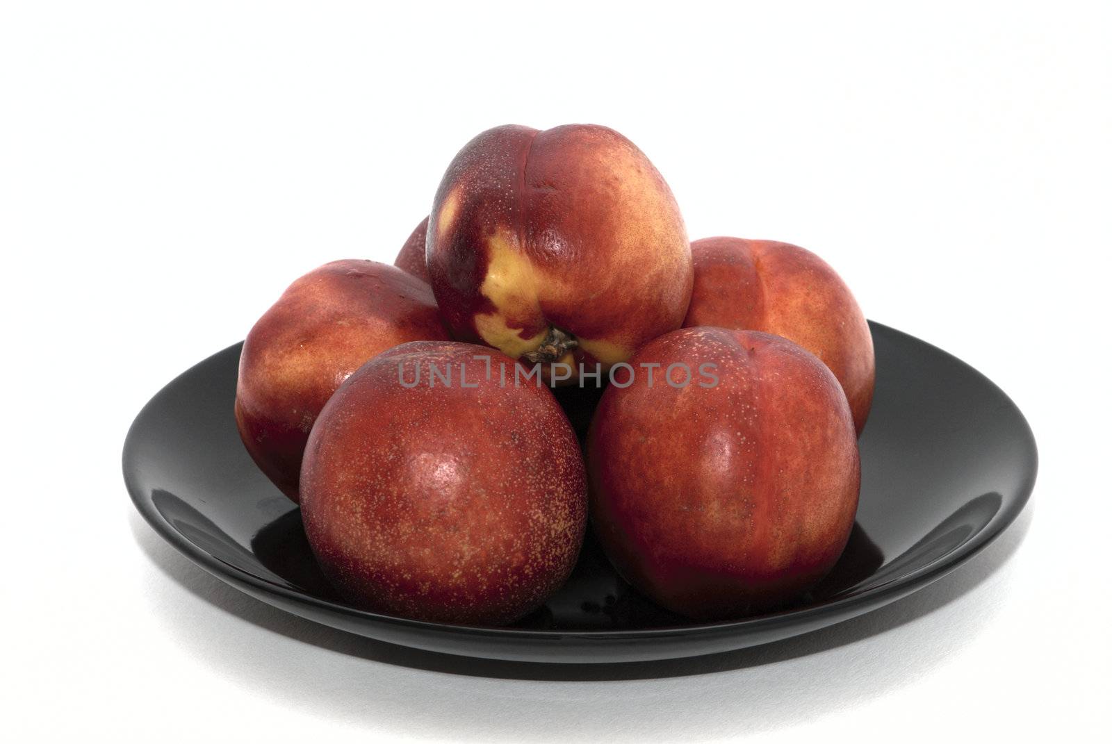 Peaches on the black plate