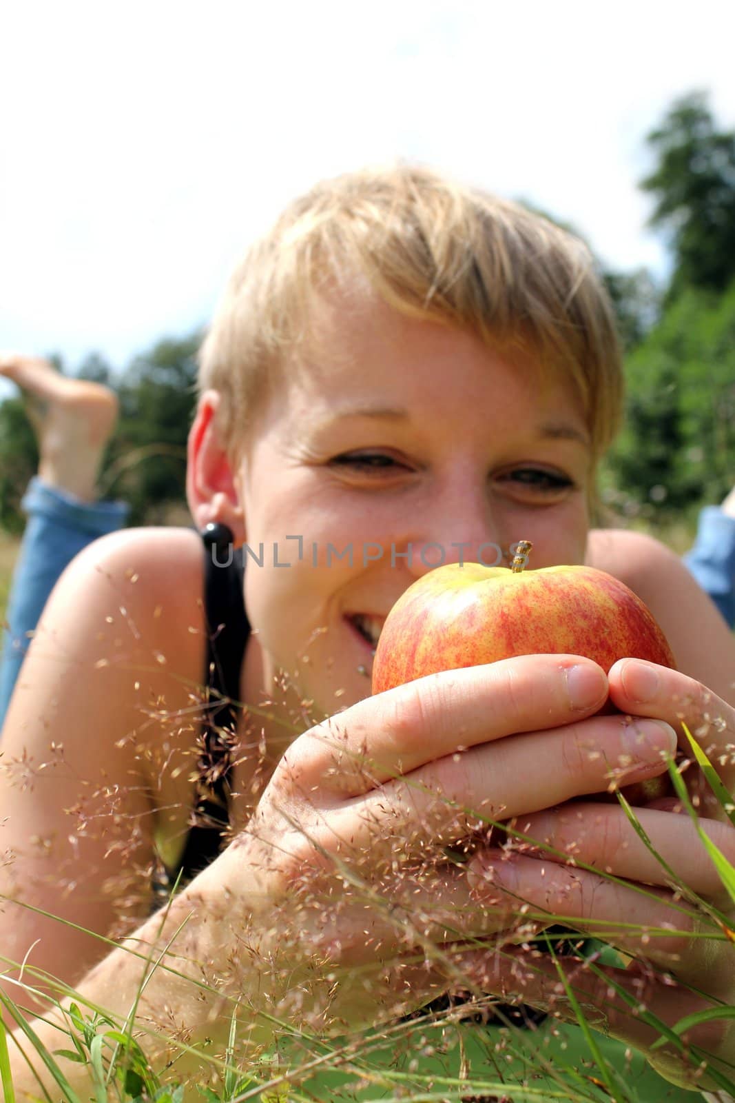 girl with apple on summer meadow by Teka77