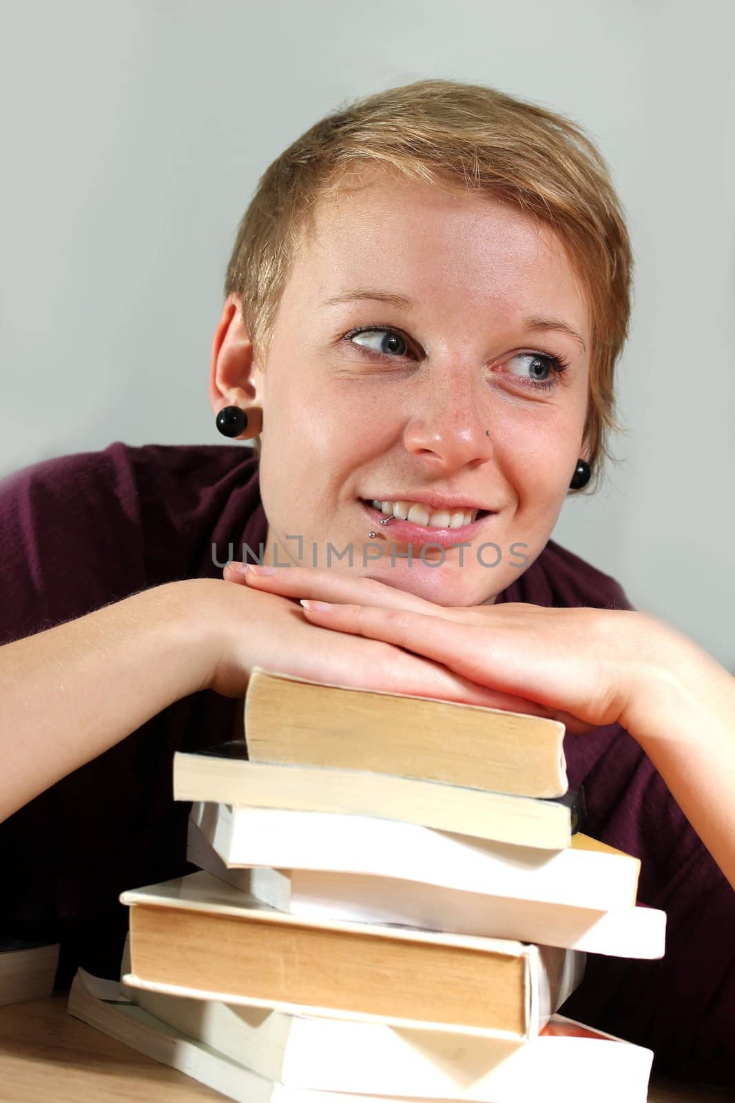 girl with books is thinking