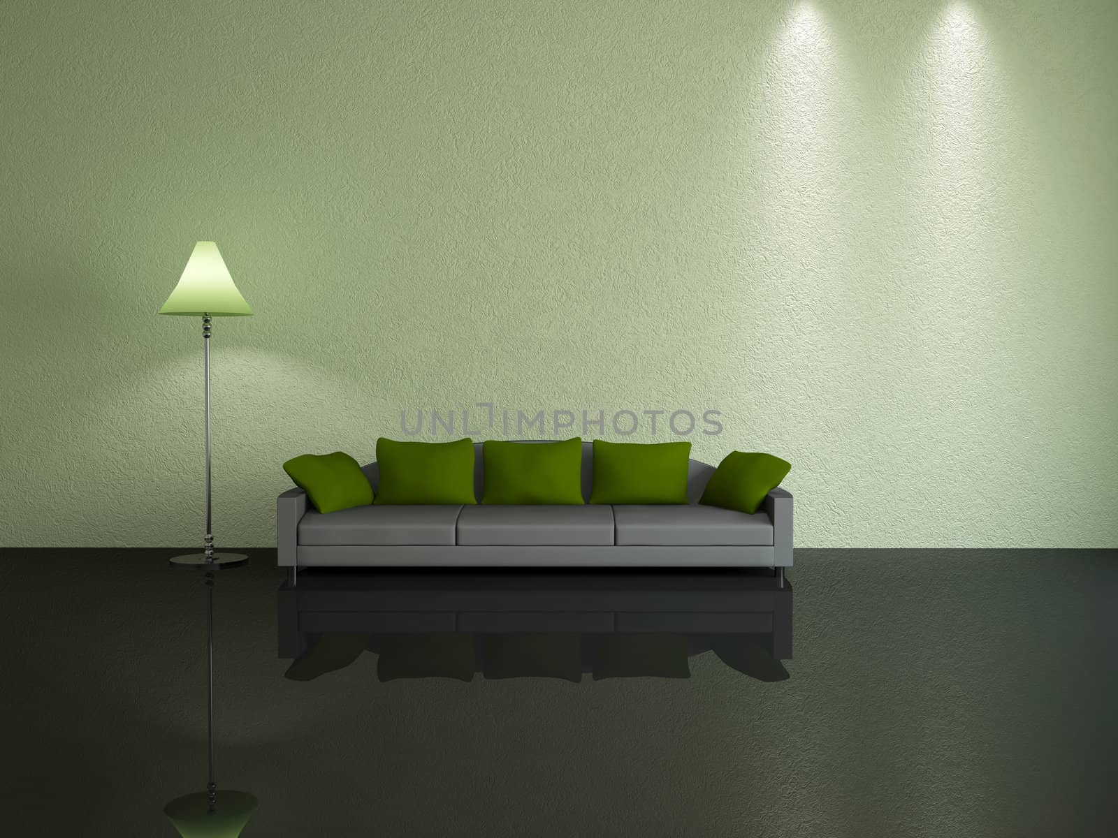 Grey sofa with green pillows near a wall