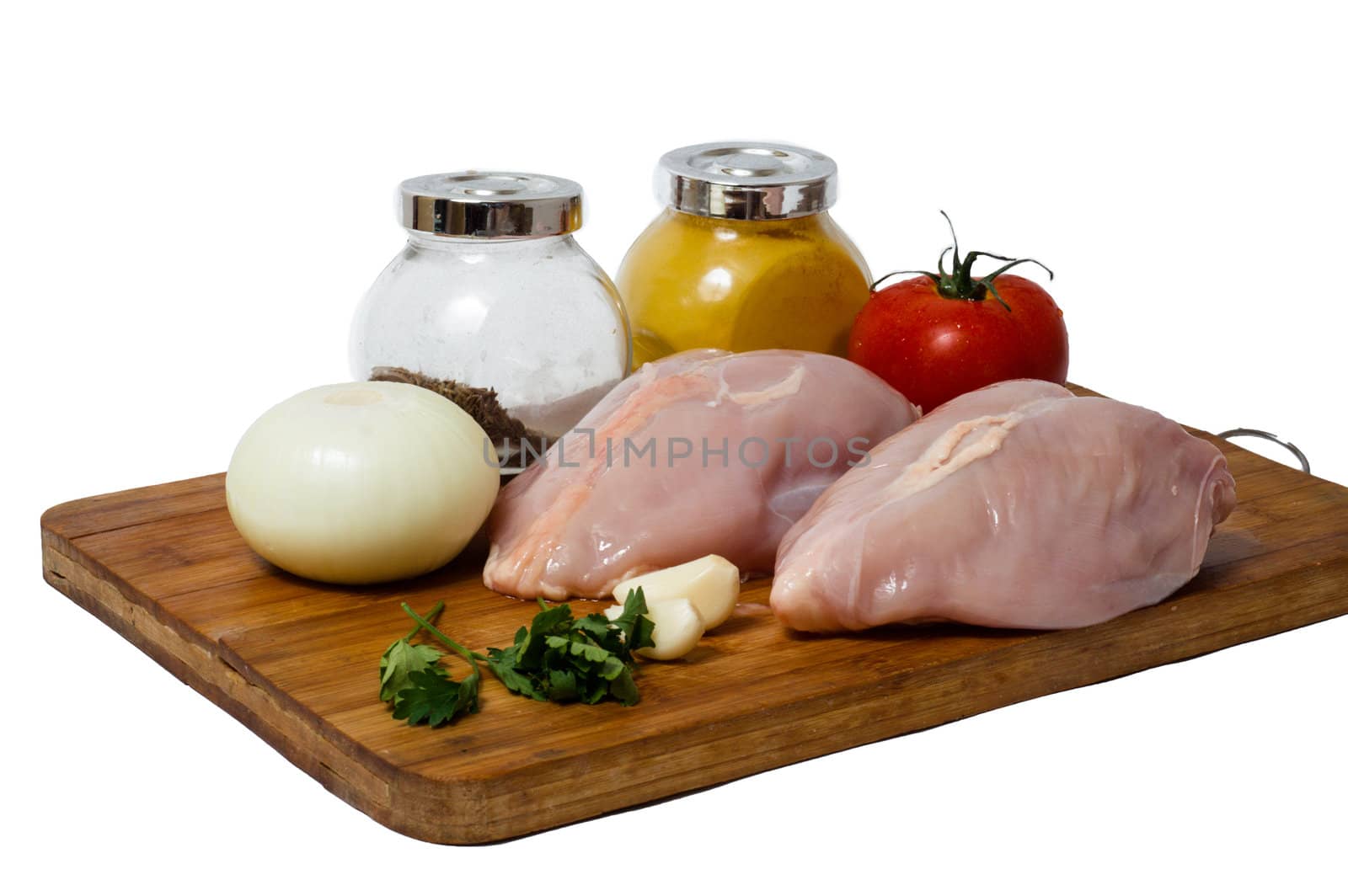 A pair of skinless chicken breasts on a cutting board