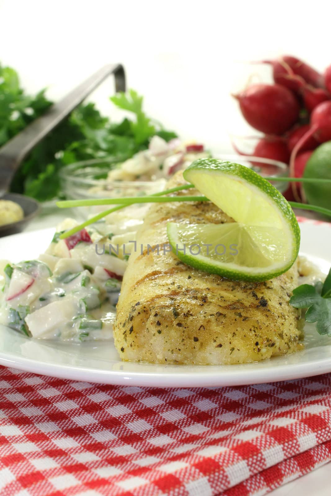 Potato salad with fresh herbs and hake fillet