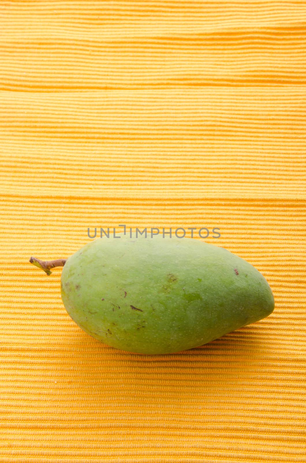 mango. green mango with background.