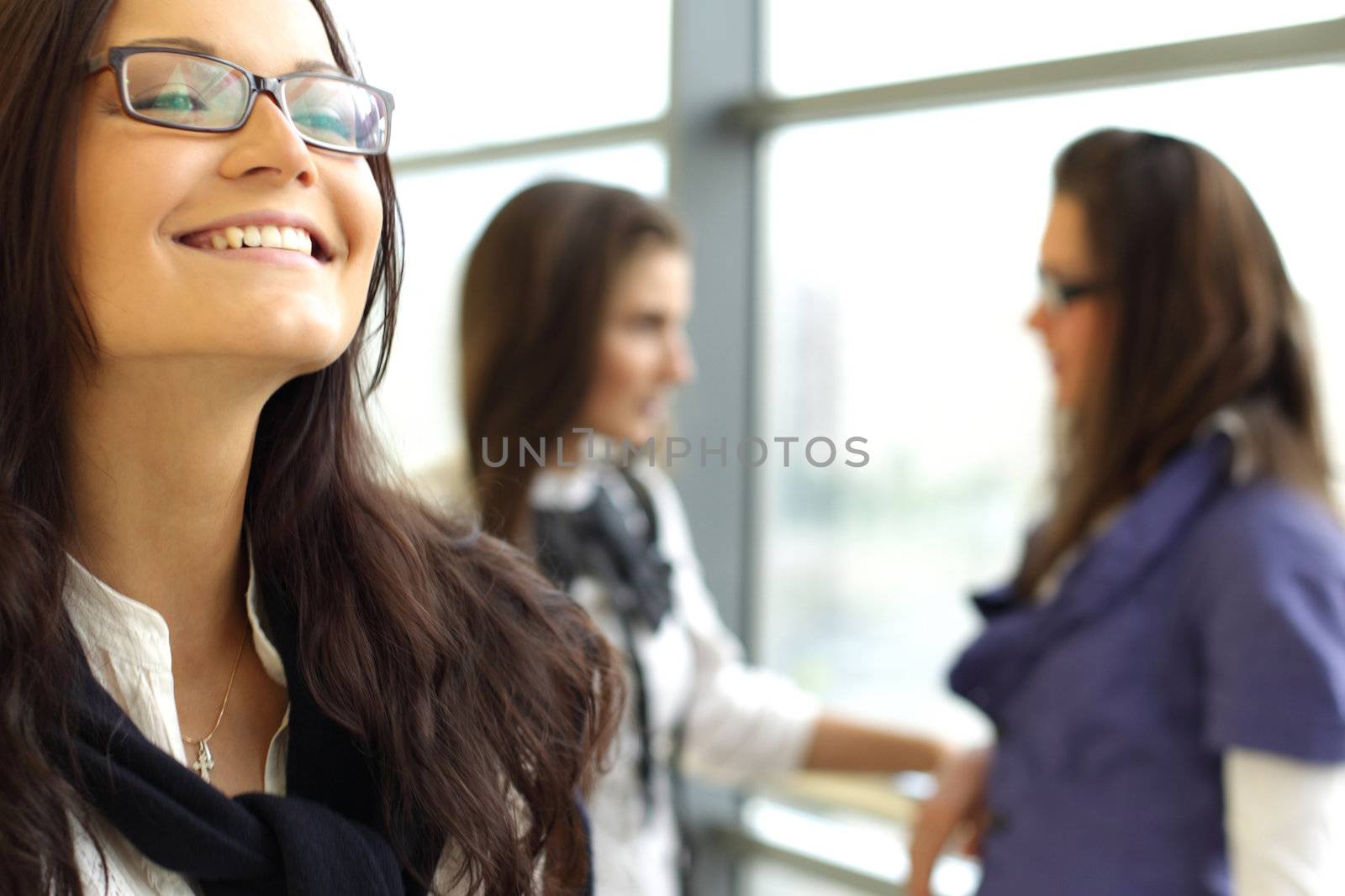 Student meeting smiley girl face on foreground 