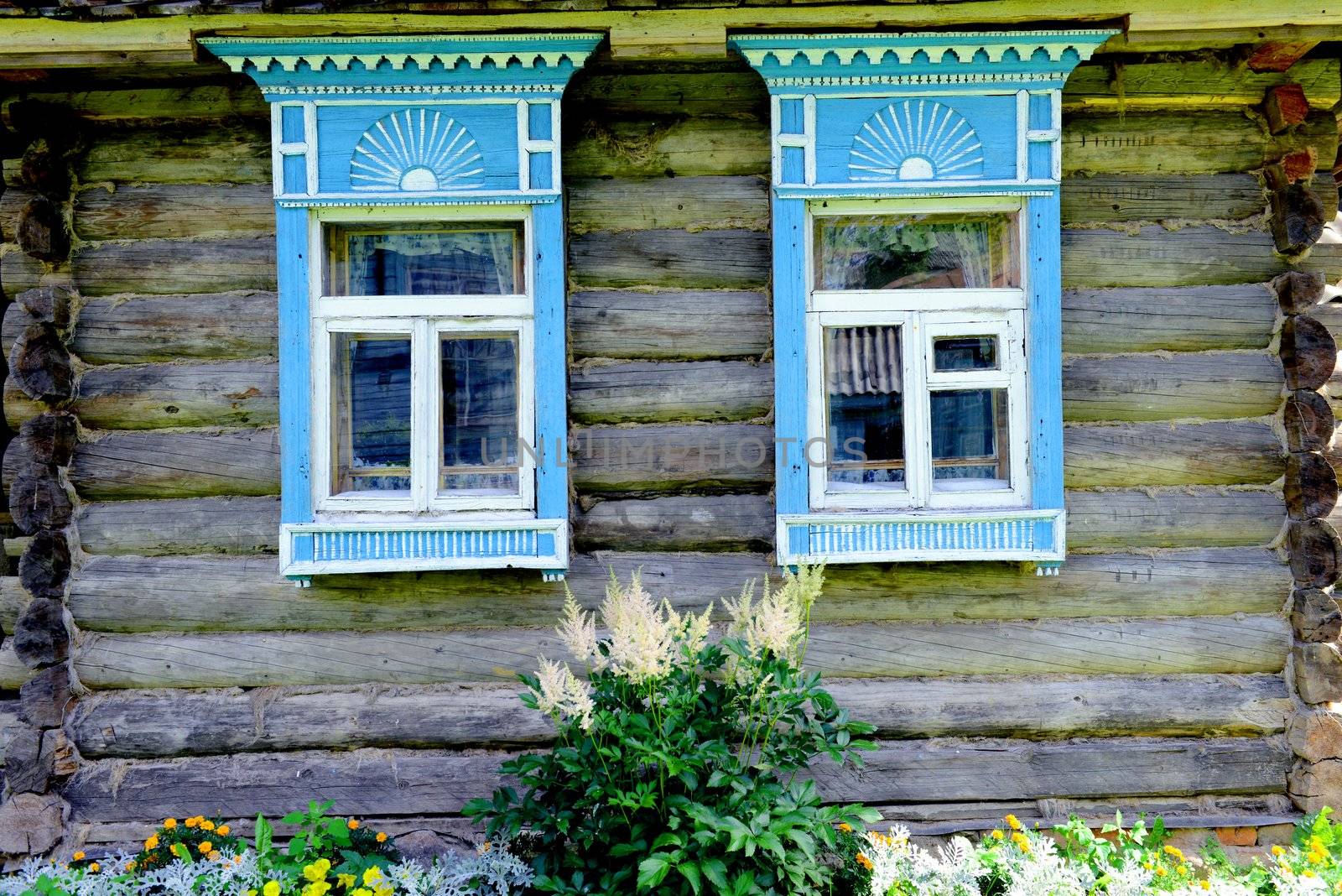 Traditional old Russian windows carved platband of wood house