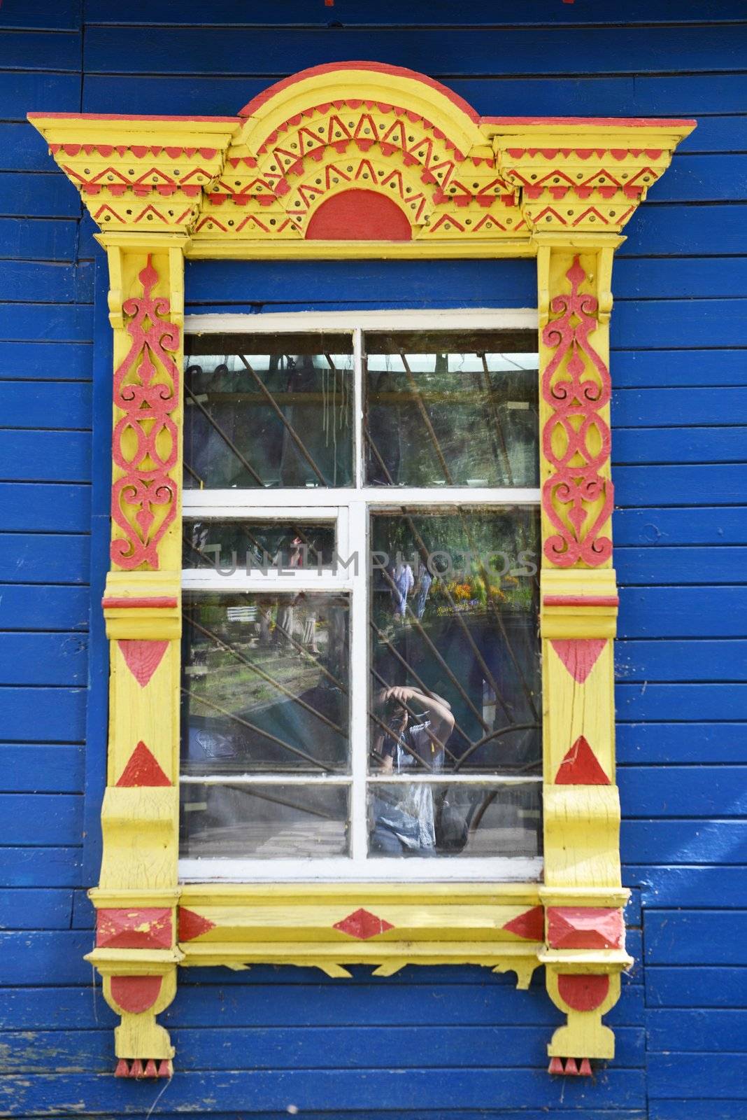 Traditional old Russian window carved platband of wood house